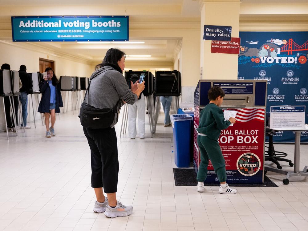 Voters drop off their ballots on Election Day at City Hall in San Francisco, Calif.