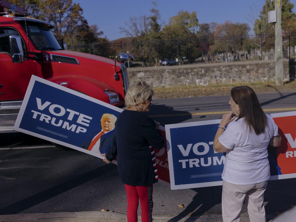 Members of the Staten Island Republican Party hold signage in support of Republican Presidential candidate Donald J. Trump for drivers passing by in Staten Island, NY.