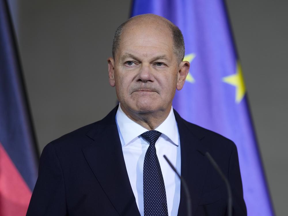 German Chancellor Olaf Scholz gives a statement after a meeting with government leaders in Berlin, Wednesday.