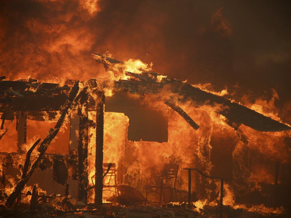 Flames engulf a structure during the Mountain Fire Wednesday, Nov. 6, 2024, near Camarillo, Calif.