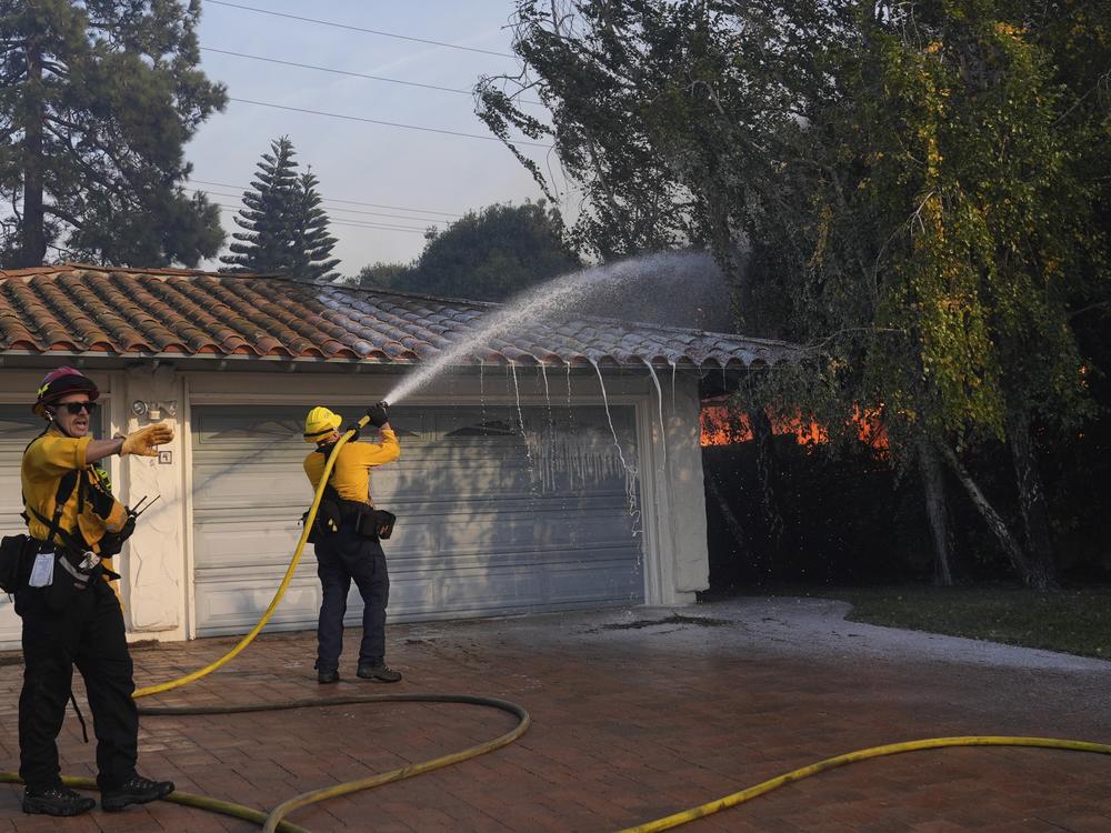 Firefighters work against the Mountain fire Wednesday, Nov. 6, 2024, near Camarillo, Calif.