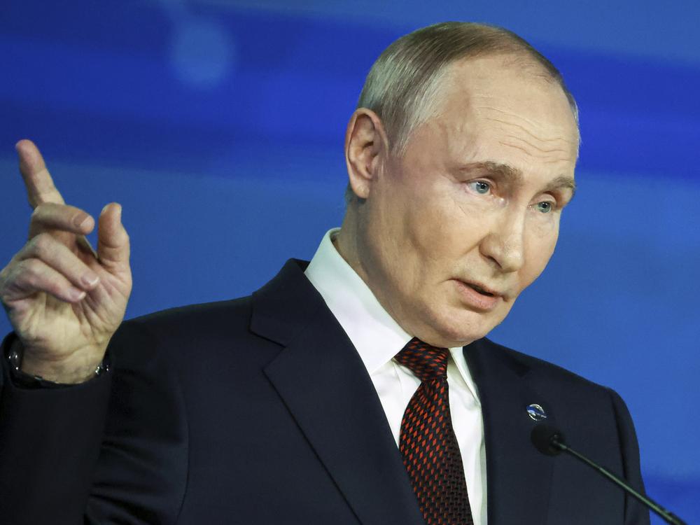 Russian President Vladimir Putin points during a meeting with foreign policy experts at the Valdai Discussion Club in the Black Sea resort of Sochi, Russia, Thursday.