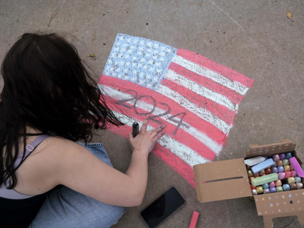 Chalk art on the sidewalk outside a polling station on the campus of Wayne State University on November 5 in Detroit, Michigan.