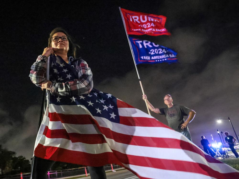 Supporters of Donald Trump gather near his Mar-a-Lago resort in Palm Beach, Florida, on Election Day.