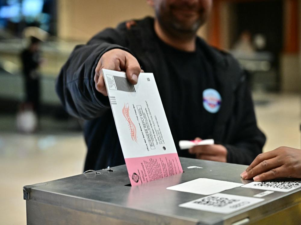People vote at a polling station at Meadows Mall in Las Vegas on Tuesday. Nevada was one of several states to vote down election reform efforts.