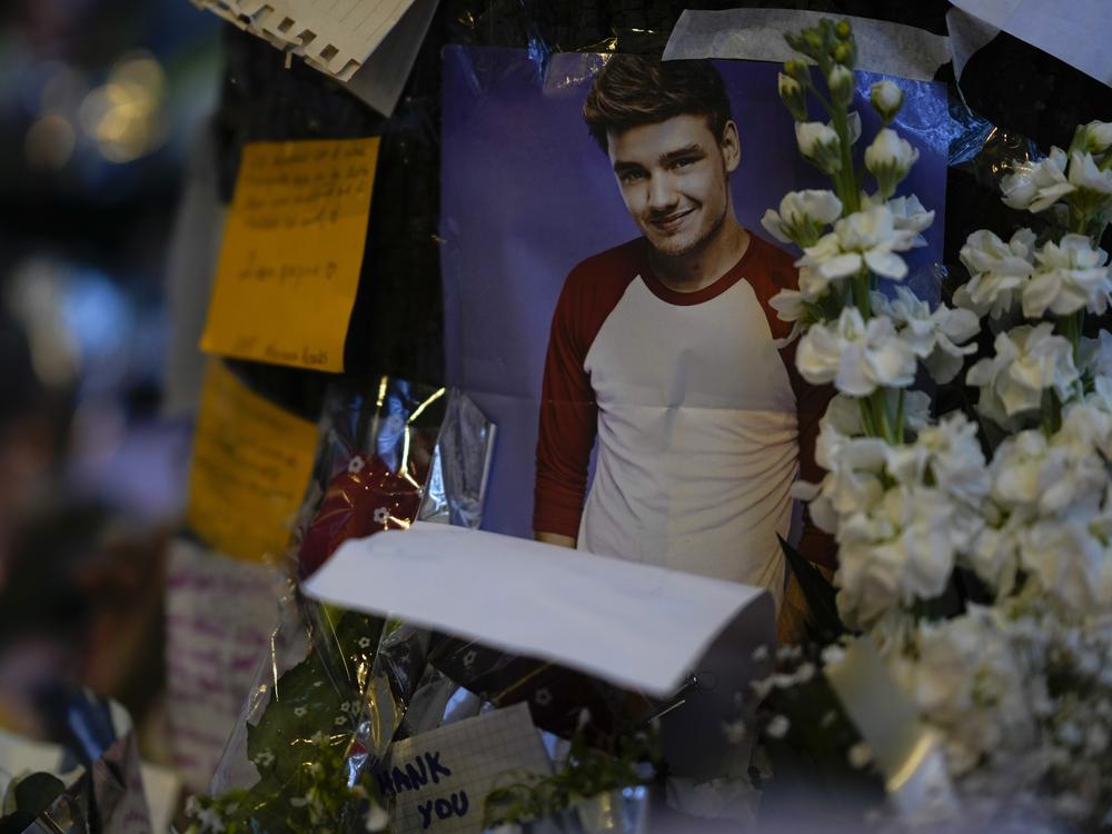 A picture of former One Direction singer Liam Payne adorns a memorial outside the hotel where he was found dead after falling from a balcony in Buenos Aires, Argentina, Thursday, Oct. 17, 2024.
