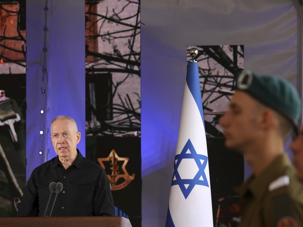 Israel's Defense Minister Yoav Gallant speaks during a ceremony marking the Hebrew calendar anniversary of the Hamas attack on October 7 last year that sparked the ongoing war in Gaza, at the Mount Herzl military cemetery in Jerusalem, Israel Sunday Oct. 27, 2024.