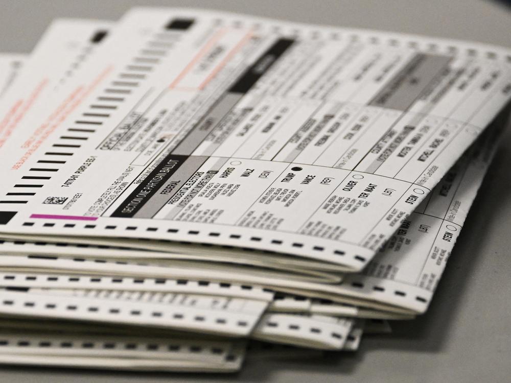 A ballot marked for Trump sits in a stack of voted ballots inside the Maricopa County Tabulation and Election Center (MCTEC) on Election Day, November 5, 2024 in Phoenix.