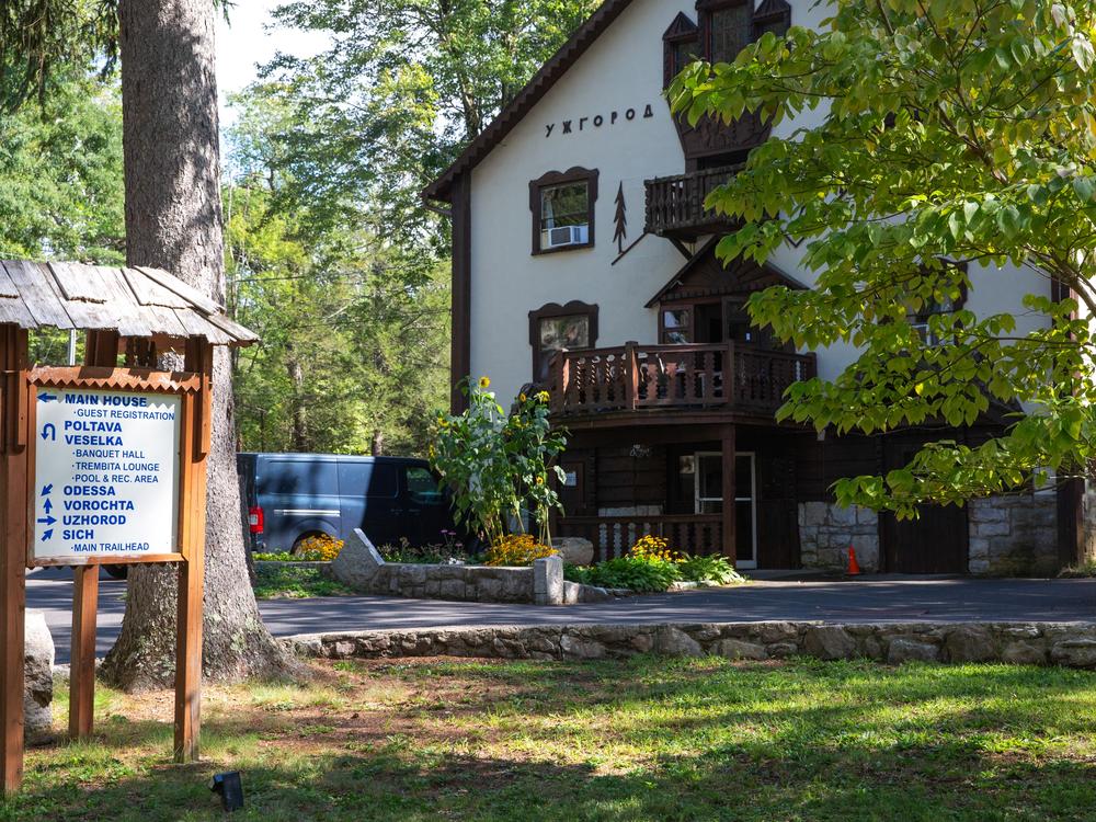 Uzhorod, a building named after the Ukrainian city that sits near the country's borders with Slovakia and Hungary, displays symbolic sunflowers next to locating signage for the heritage center.