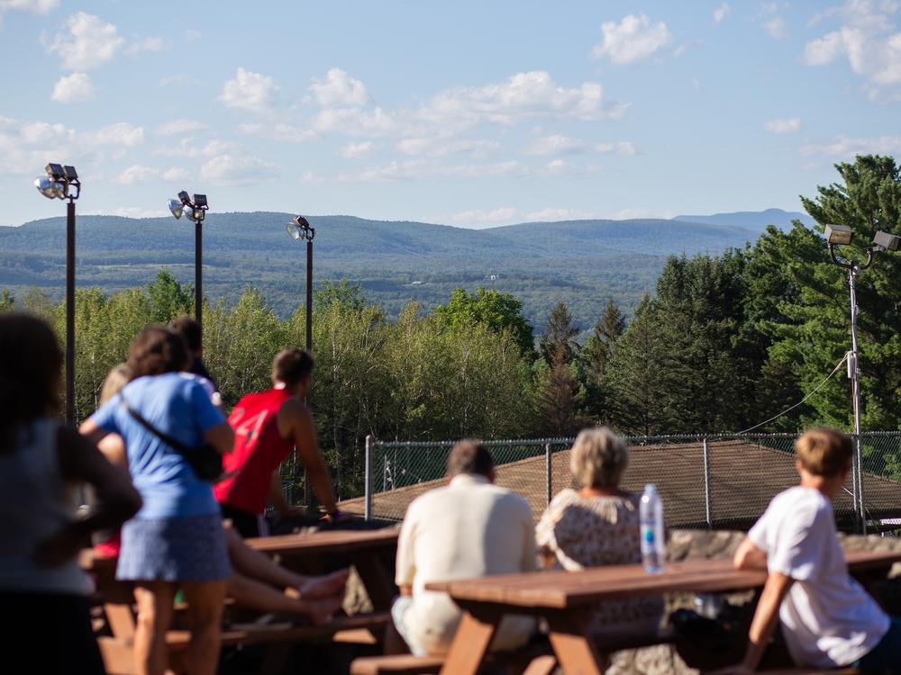 Volleyball spectators enjoy the action below while the surrounding mountains provide the perfect backdrop, reminding Soyuzivka’s founders of their beloved Carpathian Mountains.
