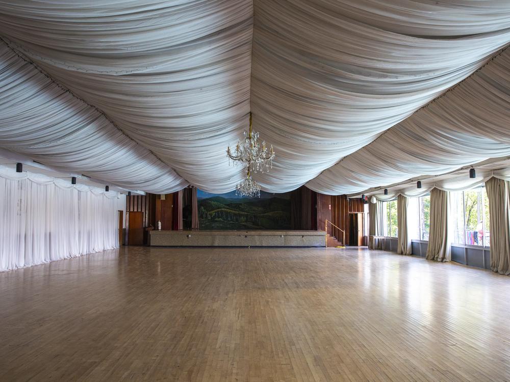The main ballroom that overlooks the pool boasts crystal chandeliers and a painted backdrop of the Carpathian Mountains.