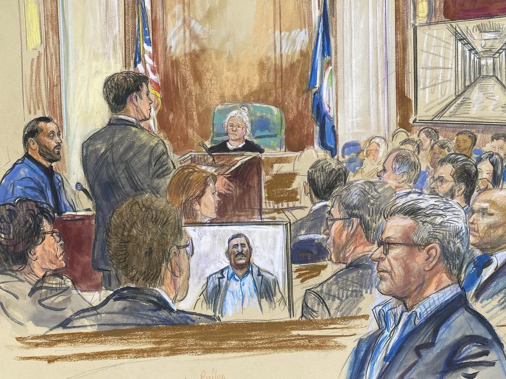 This courtroom sketch depicts a former detainee at Abu Ghraib prison, Salah Al-Ejaili (foreground with glasses), at the trial of CACI, a Virginia-based military contractor who is accused of contributing to the abuse and torture of detainees at Abu Ghraib, in U.S. District Court in Alexandria, Va., on April 16.