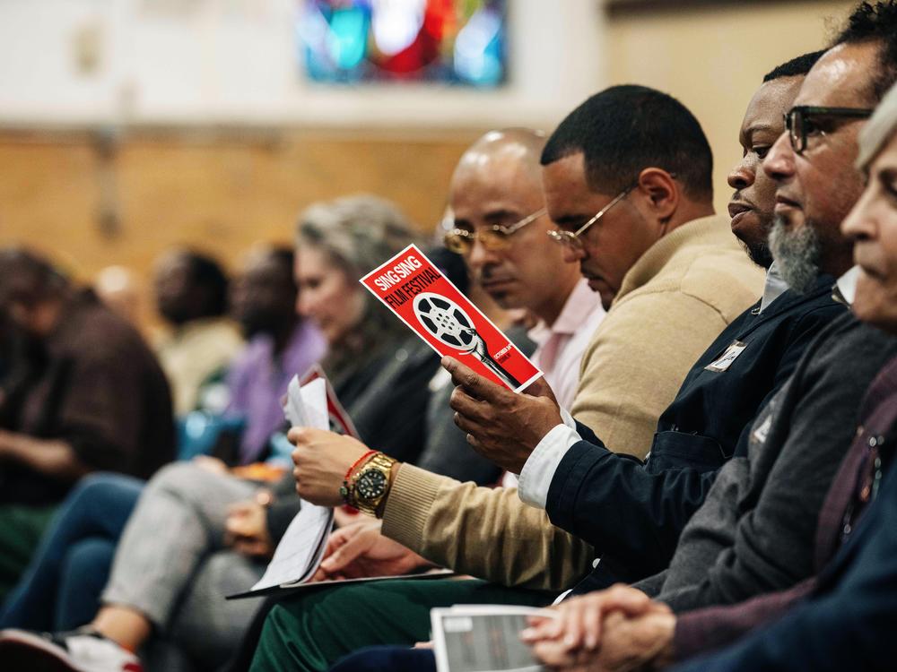 Guests and incarcerated men sit alongside each other at the Sing Sing Correctional Facility's first-ever film festival on Oct. 24.