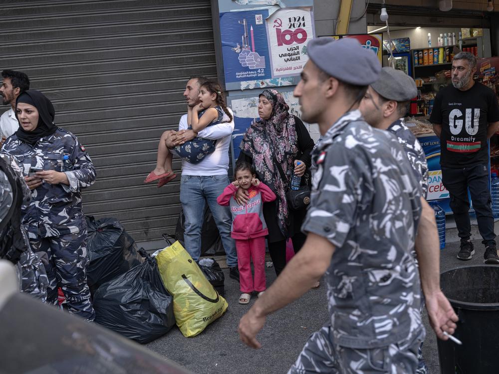 A displaced girl cries as Lebanese security forces attempt to evict her family and other displaced people — mostly Shia Muslims who have fled their homes in southern Lebanon — from the Hamra Star hotel in Beirut, in October.