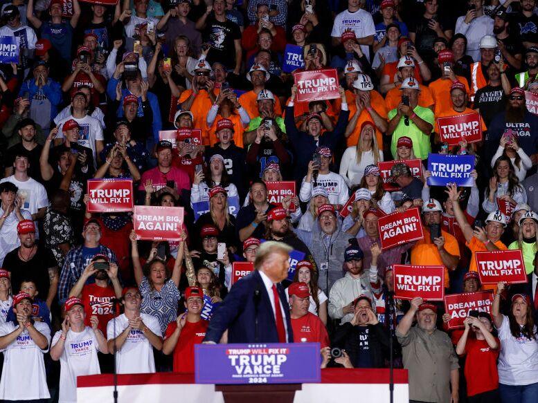 Supporters cheer as President-elect Donald Trump arrives to speak at his last campaign rally at Van Andel Arena in Grand Rapids, Mich., on Nov. 5.