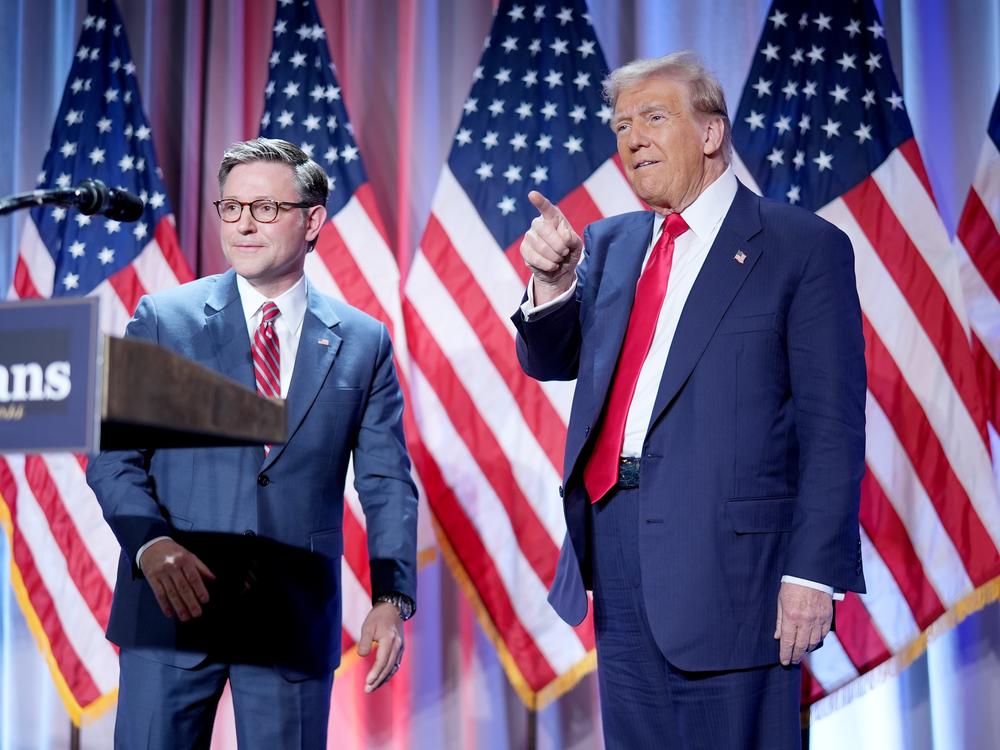 House Speaker Mike Johnson welcomes President-elect Donald Trump at a House Republicans Conference meeting at the Hyatt Regency on Capitol Hill on Nov. 13, 2024.