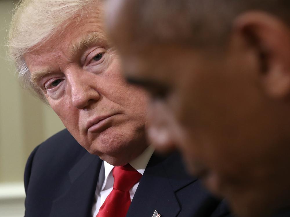 In this file photo from Nov. 10, 2016, then-President-elect Donald Trump listens to then-President Barack Obama speak after their Oval Office meeting.