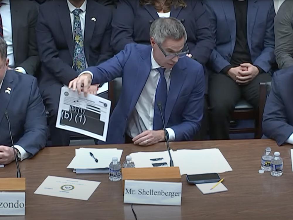 Journalist Michael Shellenberger, founder of the Public news outlet, displays redacted reports during a hearing on Capitol Hill Wednesday as he stresses the need for more transparency over UAP investigations.
