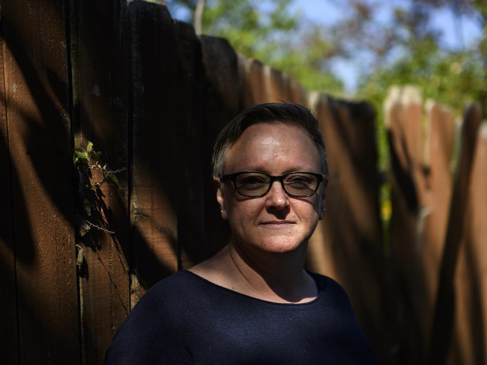 Natalie Donaldson, an Army veteran, poses for a portrait at her home in Tulsa, Okla. A COVID assistance program that was supposed to help her avoid foreclosure ended up increasing her mortgage payments by 50% every month.