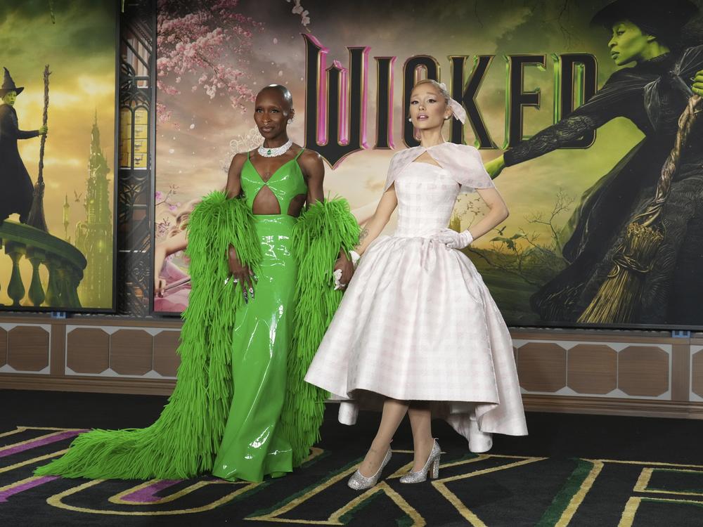 Cynthia Erivo, left, and Ariana Grande arrive at the premiere of <em>Wicked</em> in Los Angeles on Saturday. Mattel is among the many brands that have collaborated on <em>Wicked</em>-themed products ahead of the movie's release.