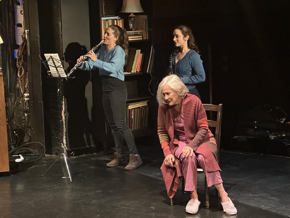 Soprano Lucy Shelton (right) plays the role of Lili, an aging opera singer struggling with memory loss. Yasmina Spiegelberg (left) and Cristina María Castro are also in the cast. <br><br>