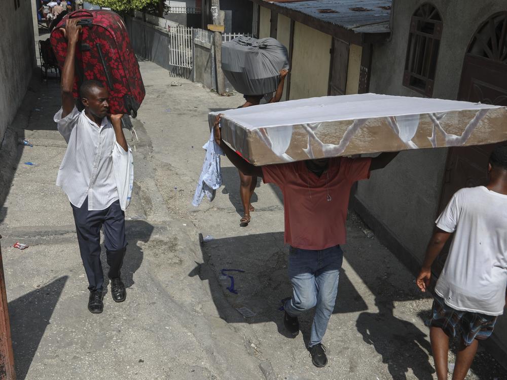 Residents flee their homes to escape gang violence in the Nazon neighborhood of Port-au-Prince, Haiti on Thursday.