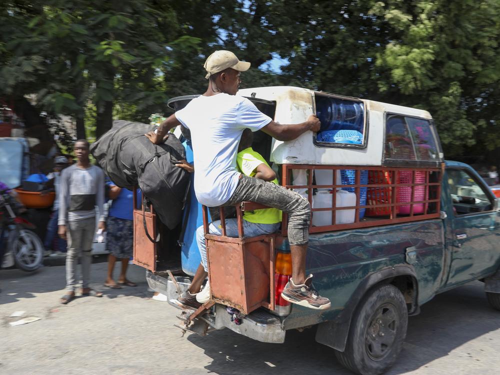 Residents flee their homes to escape gang violence in the Nazon neighborhood of Port-au-Prince, Haiti on Thursday.
