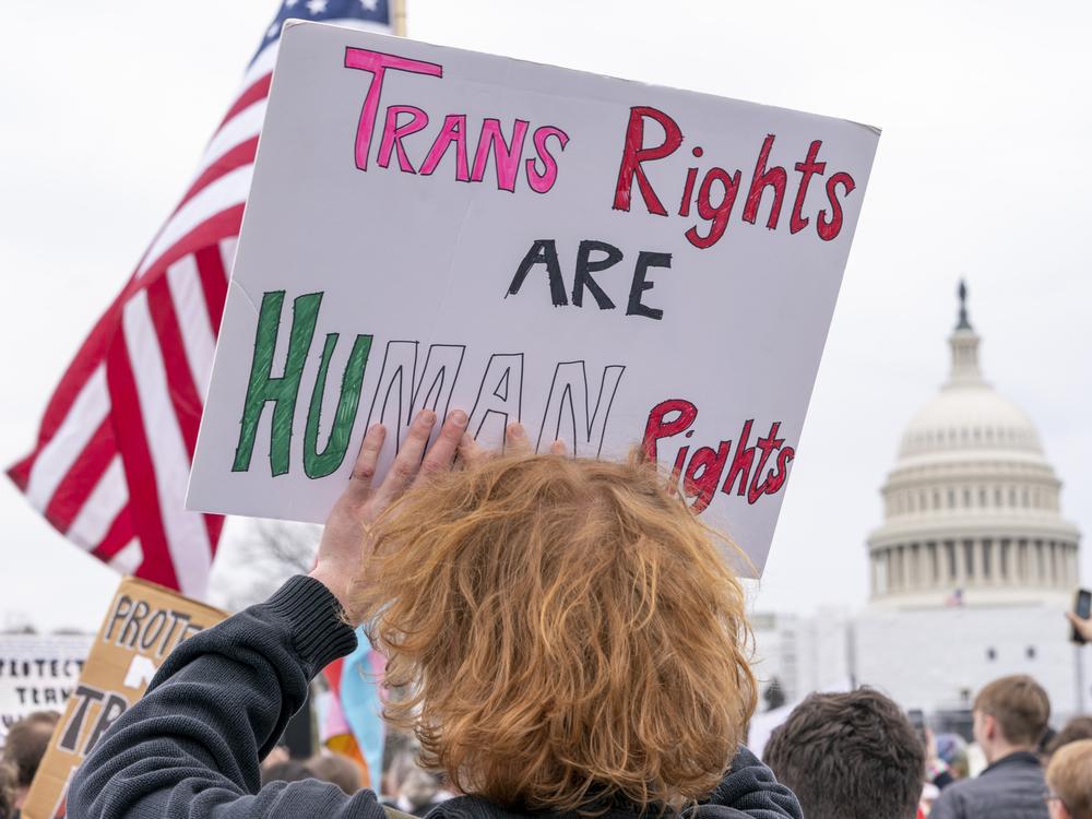 People attend a rally as part of a Transgender Day of Visibility on March 31, 2023, by the U.S. Capitol in Washington.