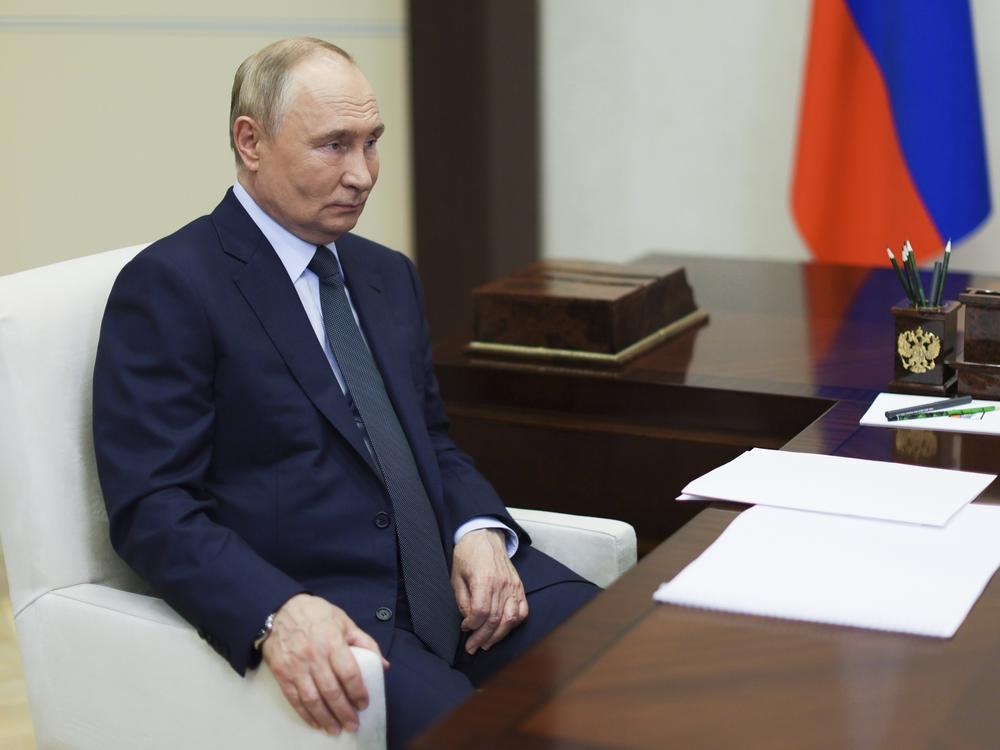 Russian President Vladimir Putin speaks with the head of Russian state space corporation Roscosmos Yuri Borisov during their meeting at Novo-Ogaryovo state residence outside of Moscow, Russia, Friday, Nov. 15, 2024.