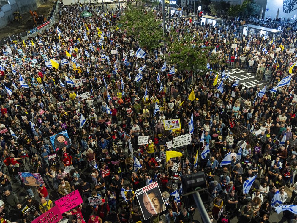 People gather to protest against Prime Minister Benjamin Netanyahu's government and call for the release of hostages held in the Gaza Strip by the Hamas militant group, in Tel Aviv, Israel, Saturday, Nov. 16, 2024.