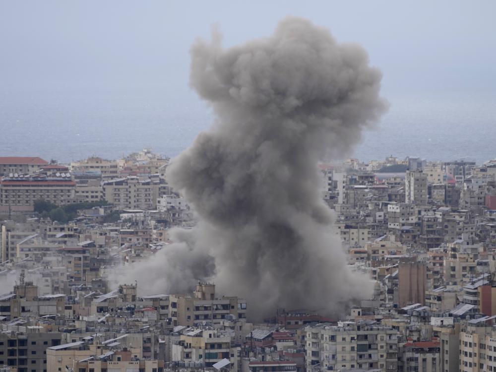 Smoke rises between buildings hit in a Israeli airstrike in Dahiyeh, in the southern suburb of Beirut, Lebanon, Sunday, Nov. 17, 2024.