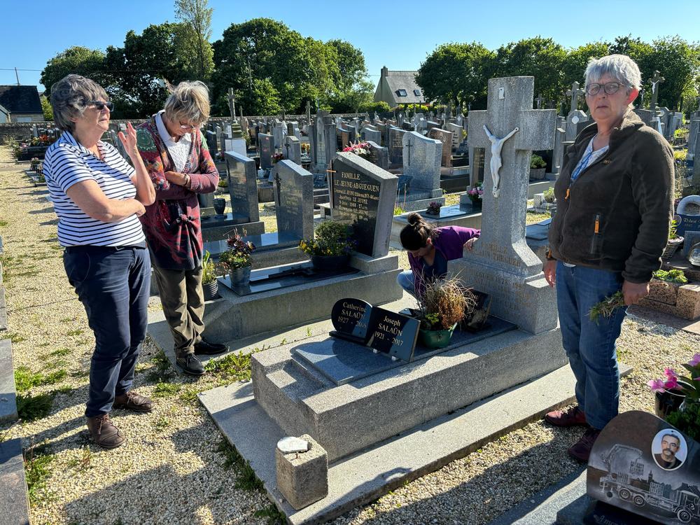 From left: Michelle Salaün, Jeannine Plassard and Marie-Annick Gouez, the daughters of Catherine Tournellec Salaün, stand at their mother's grave in Plabennec, in France's Brittany region, in June.