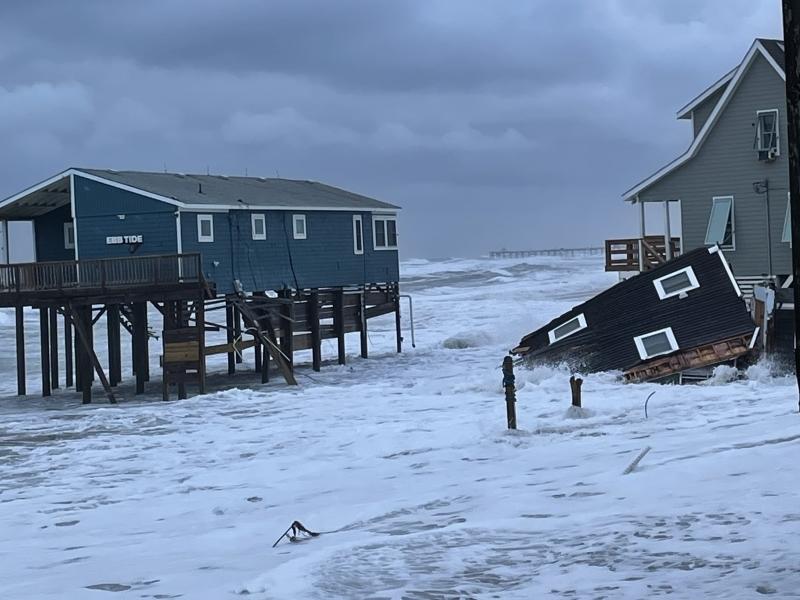 A portion of a house that collapsed during the overnight hours of Thursday and Friday is seen in the water in Rodanthe, N.C.