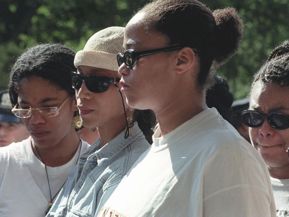 Malcolm X's daughters, Malikah Shabazz (from left), Attallah Shabazz, Malaak Shabazz and Gamilah Shabazz, talk to the media outside the Jacobi Medical Center in the Bronx borough of New York, following the death of their mother, Betty Shabazz on June 23, 1997. A new lawsuit accuses the CIA, FBI, the New York Police Department and others of playing roles in the 1965 assassination of the civil rights leader.