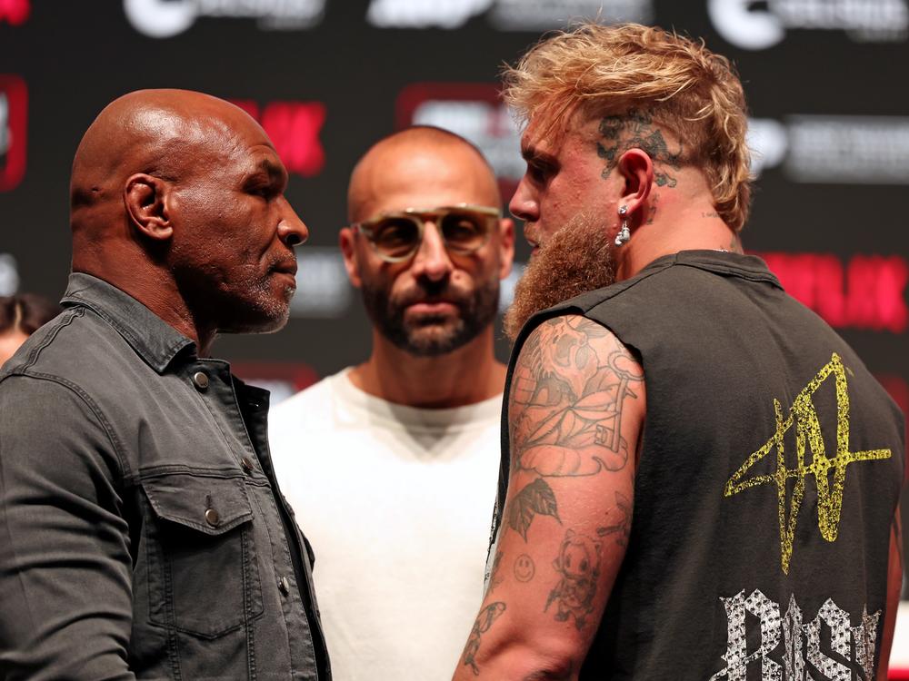 Mike Tyson, Jake Paul's manager Nakisa Bidarian, and Jake Paul at a press conference this week ahead of Friday's fight.