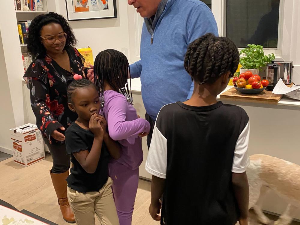 Ayesha Rascoe with her kids and food journalist, Mark Bittman.