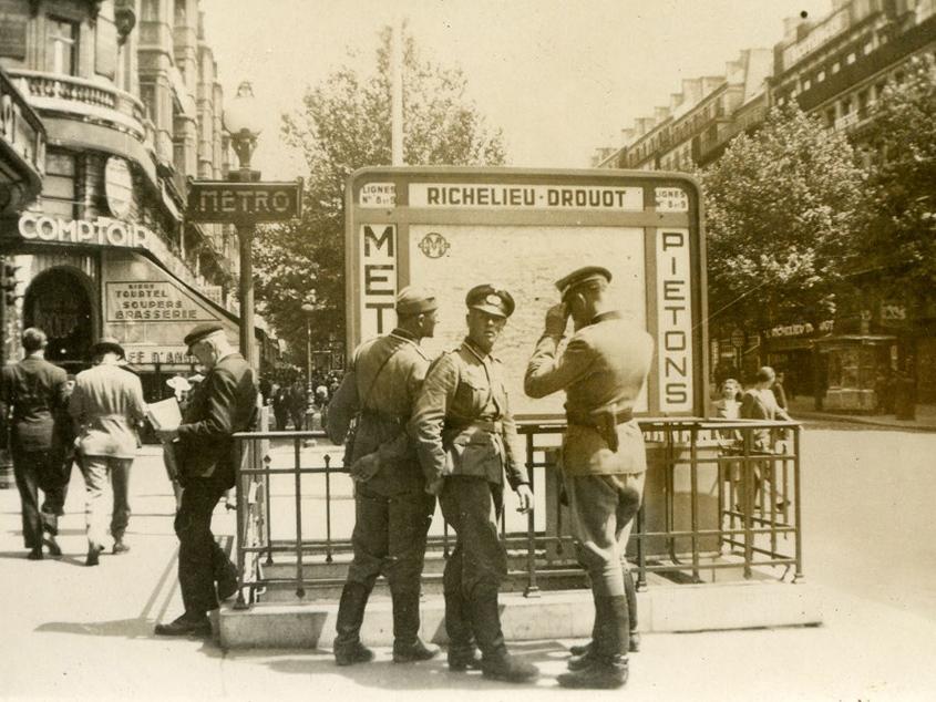 A photograph of German soldiers at the entrance to the Richelieu-Drouot metro station in Paris.