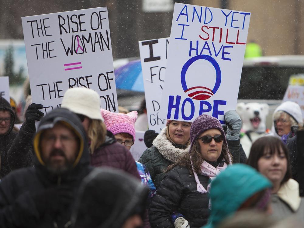 Protesters wave signs and chant during a Women's March, Jan. 20, 2018, in Casper, Wyo.