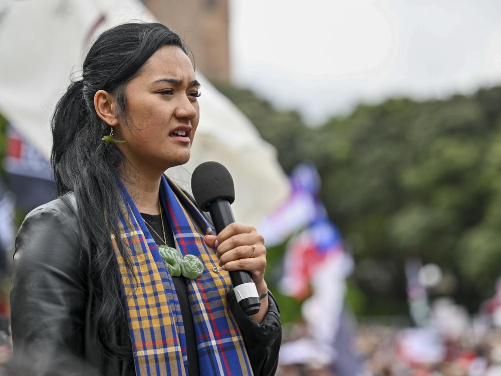 Hana-Rāwhiti Maipi-Clarke speaks to the thousands of people gathered outside New Zealand's parliament to protest a proposed law that would redefine the country's founding agreement between Indigenous Māori and the British Crown, in Wellington on Tuesday.