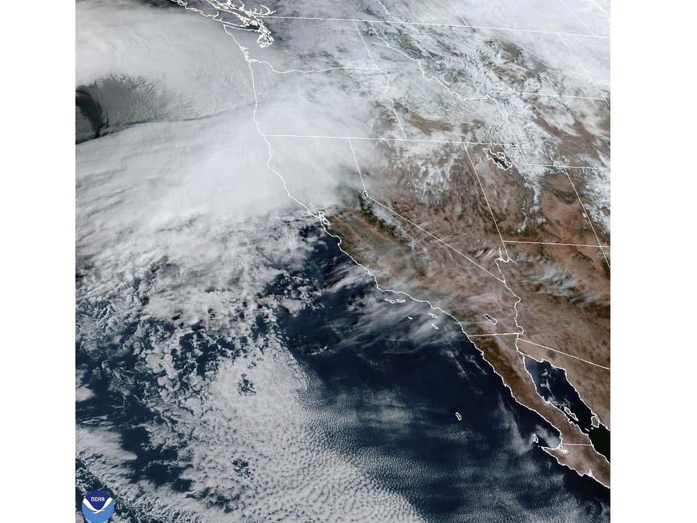 This satellite image Tuesday shows weather gathering in northern California and the Pacific Northwest.