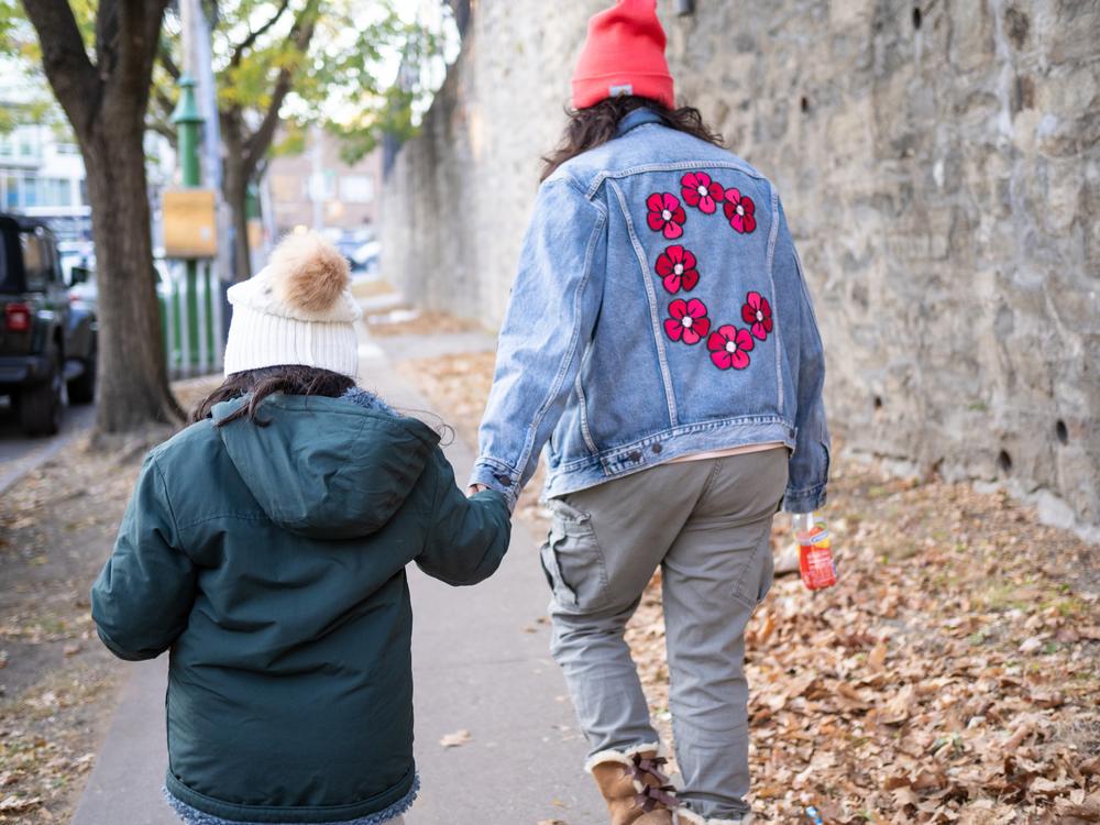 Carolina Saavedra and her daughter in the Bronx. Yunuen Bonaparte/NPR