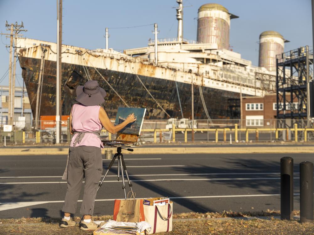 The SS United States' departure from Philadelphia has been delayed by the weather. A team from NPR climbed aboard before it takes its final voyage.
