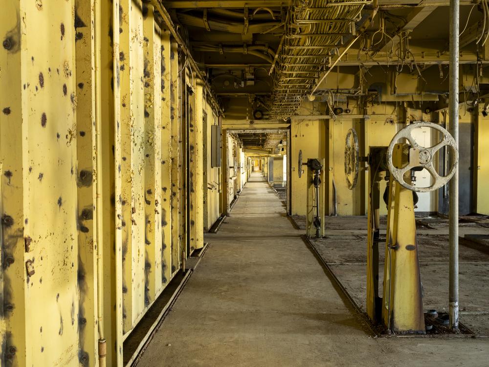 The United States' mid-20th century modern interiors were long ago stripped to dispose of asbestos, though the spaces still suggest their past grandeur.