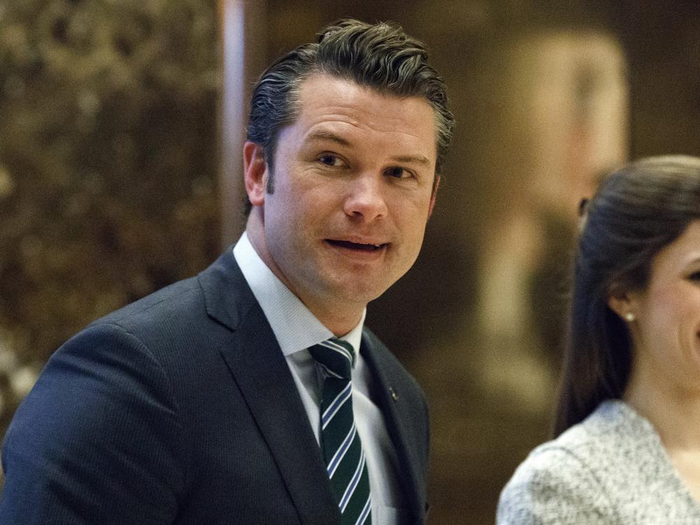 Pete Hegseth walks to an elevator for a meeting with President-elect Donald Trump at Trump Tower in New York on Dec. 15, 2016.