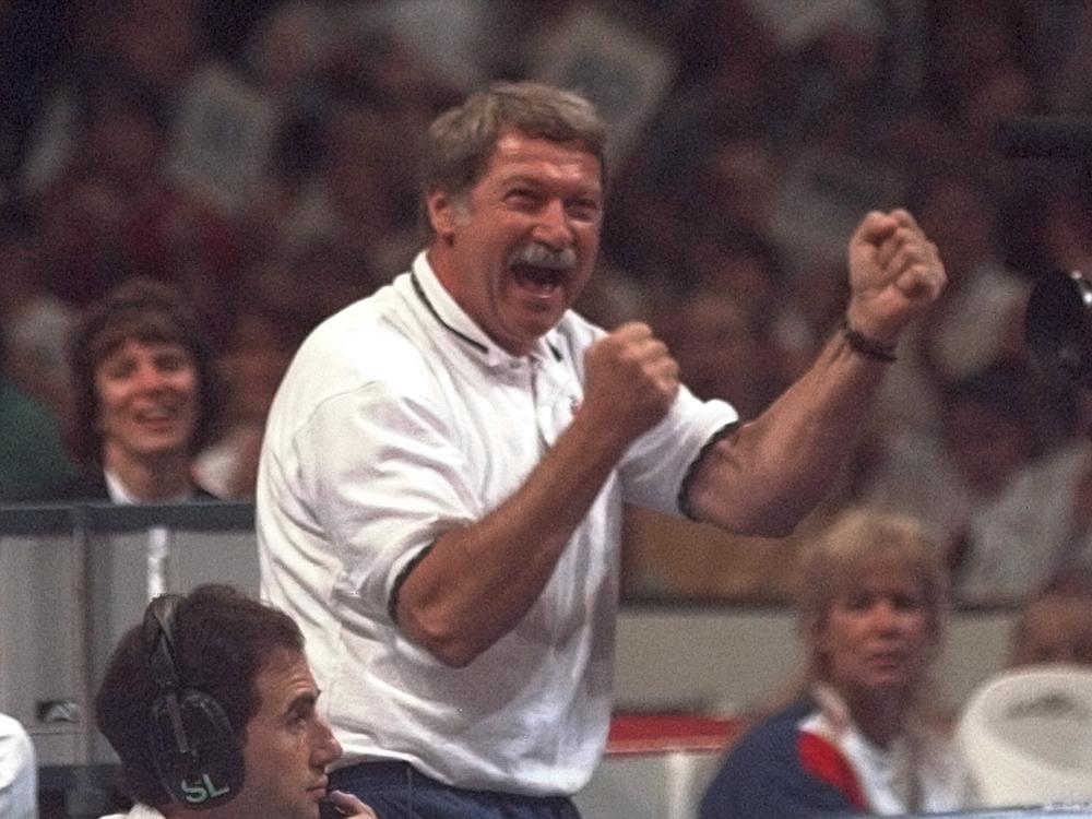 Bela Karolyi reacts with joy as his gymnastics student Kerri Strug finishes a routine on the balance beam during the U.S. Olympic Trials in gymnastics, on June 30, 1996, in Boston.