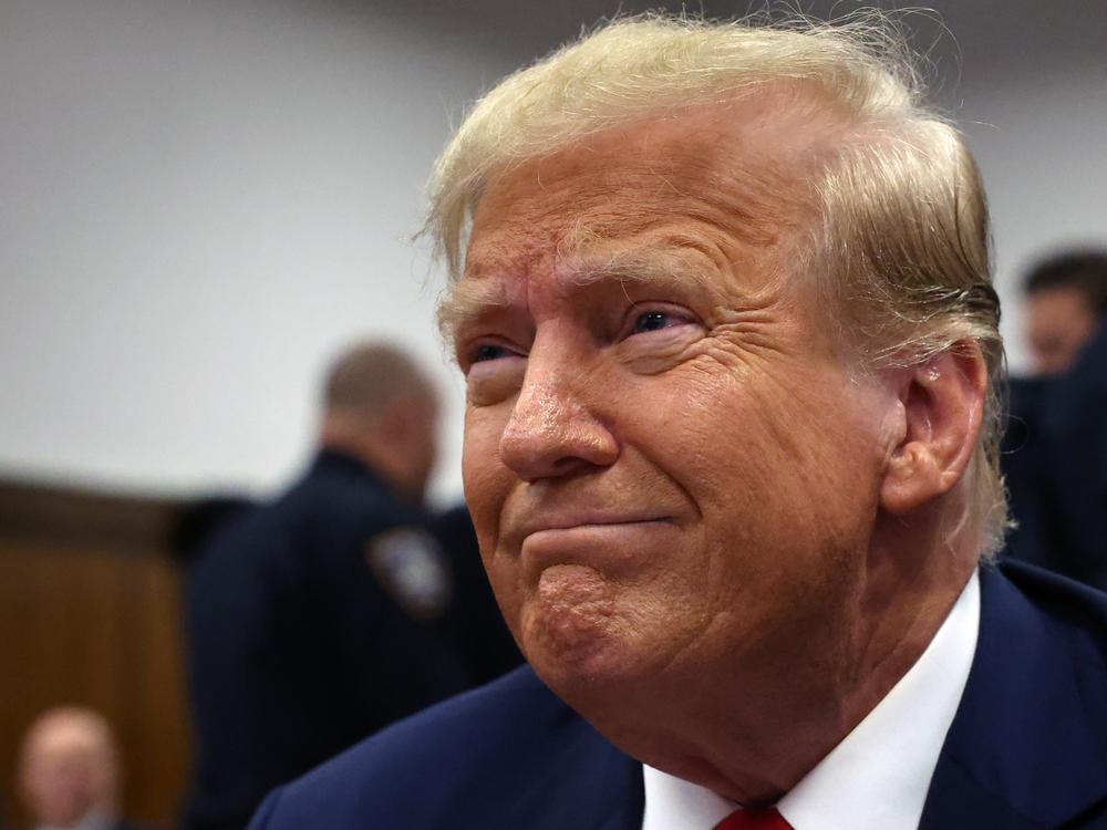 Donald Trump sits in a Manhattan criminal courtroom with members of his legal team for the continuation of his hush money trial on April 25, 2024 in New York City.