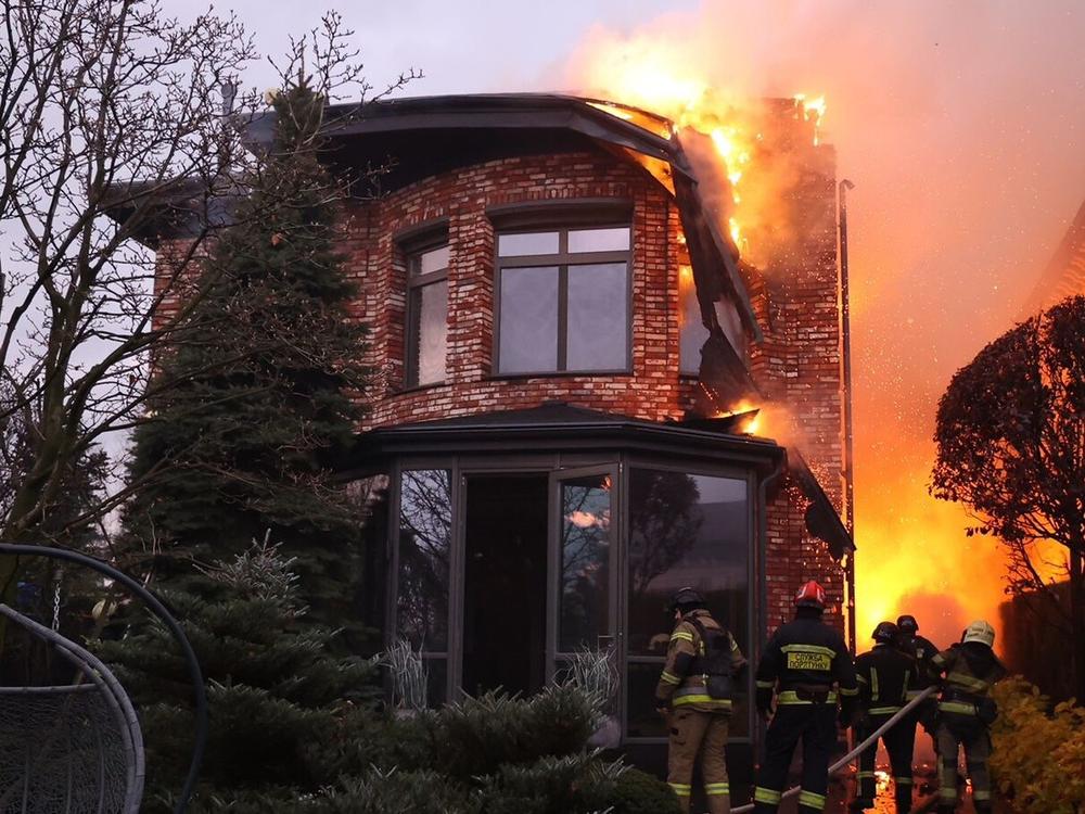 Emergency units carry out rescue tasks after a Russian attack on the city of Dnipro, in central Ukraine, on Thursday. Ukrainian officials are trying to determine whether Russian forces launched an intercontinental ballistic missile and other types of missiles.