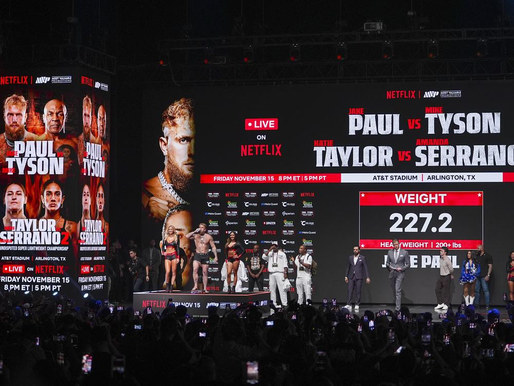 Jake Paul steps on the scale during a weigh-in ahead of his heavyweight bout against Mike Tyson, Thursday, Nov. 14 in Irving, Texas.