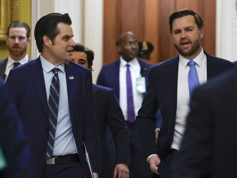Former Rep. Matt Gaetz, R-Fla., (left) is seen on Capitol Hill Wednesday to discuss with senators his nomination to be attorney general under President-elect Donald Trump. He is escorted by Vice President-elect JD Vance.