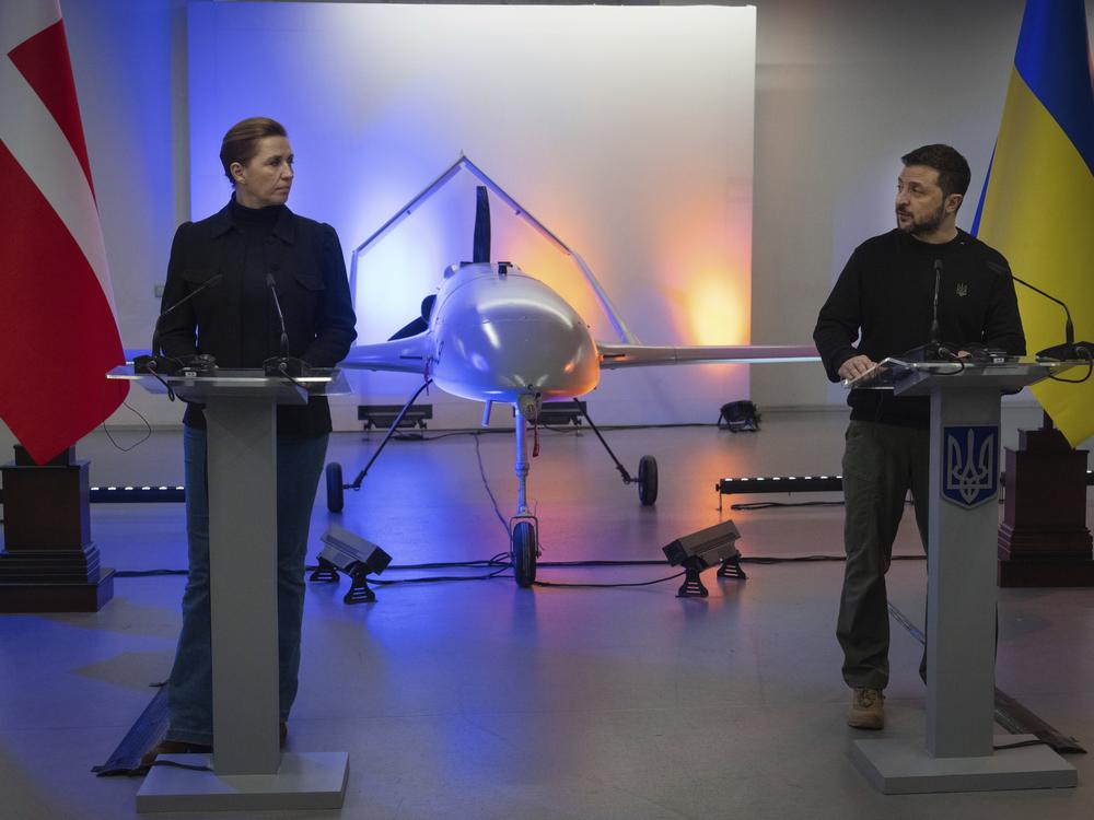 Ukraine's President Volodymyr Zelenskyy speaks with Danish Prime Minister Mette Frederiksen on Nov. 19 in front of a drone the Ukrainians have built with funding from Denmark. Ukraine has rapidly developed an extensive drone industry that plays a critical role in the war with Russia. The inexpensive, homemade drones carry out attacks on the frontline in Ukraine and also deep inside Russia.